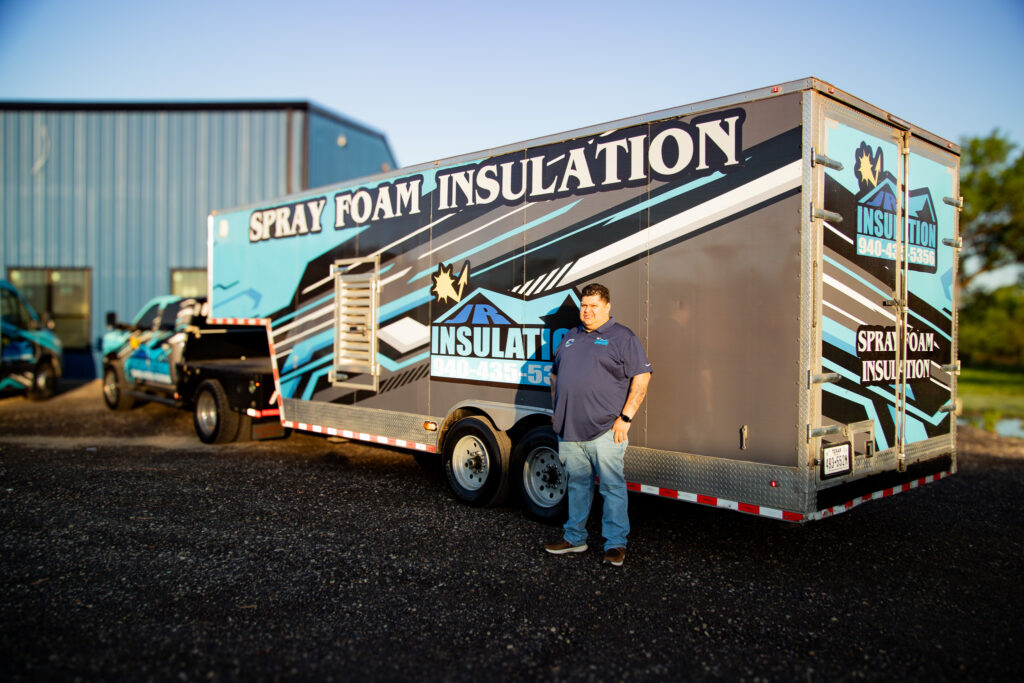 Joaquin Martinez Owner of Jr Insulation in front of a rig.
